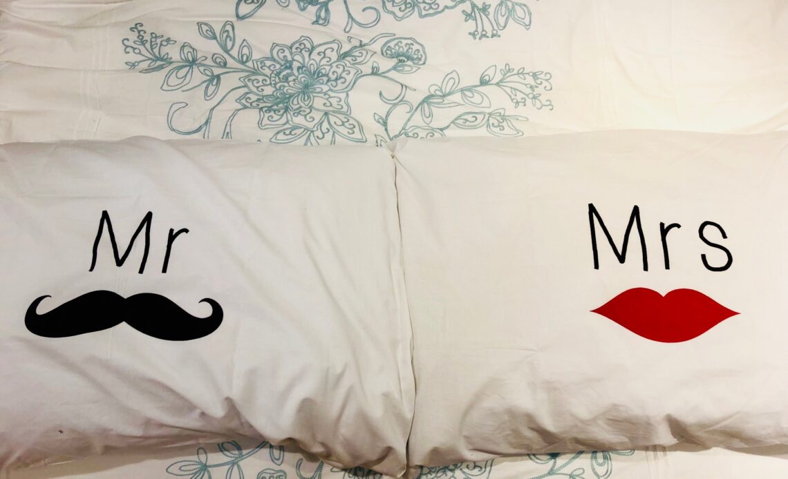Personalized pillowcases on a bed.