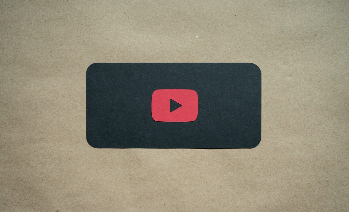 a black square with a red youtube logo on it